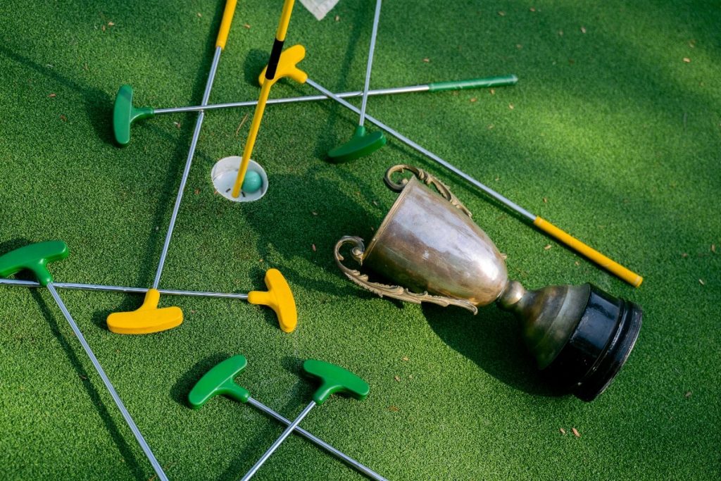 Mini golf fundraiser - trophy and golf clubs