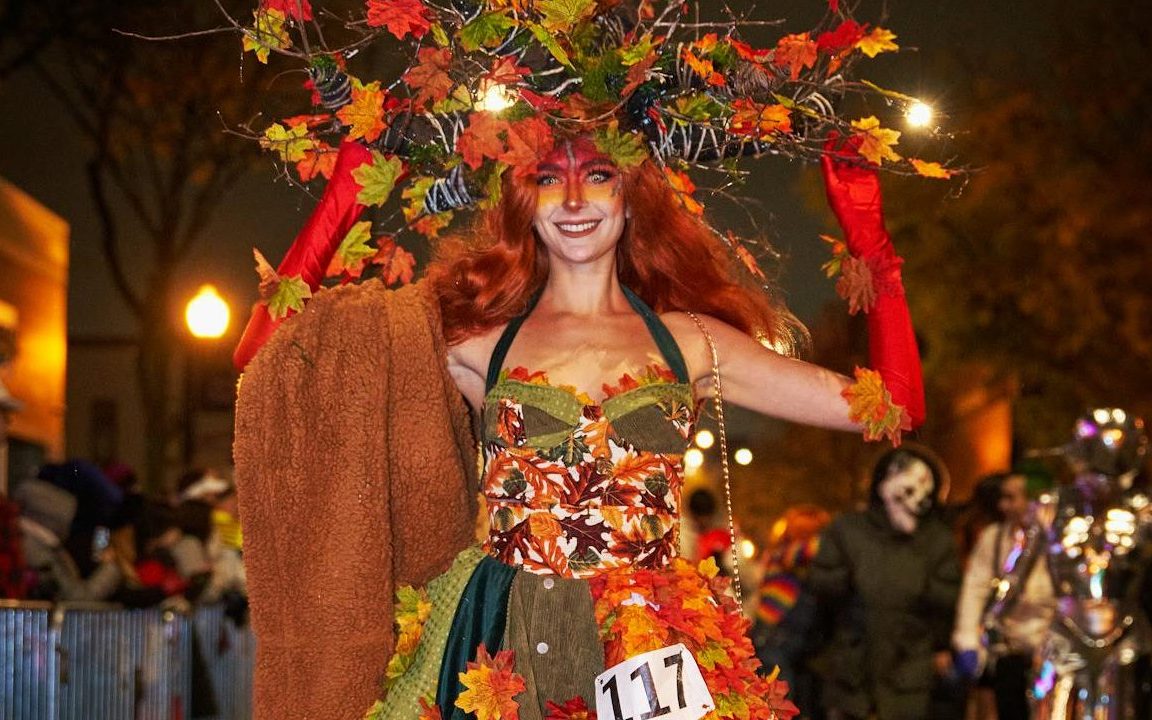 a woman dressed as a fall queen walking for a costume walkathon for fall fundraising ideas